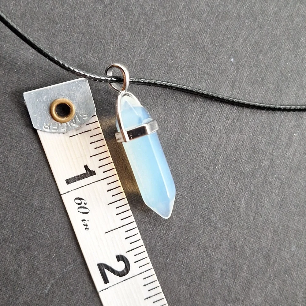 Clear crystal point pendant necklace on 16-inch faux leather chain